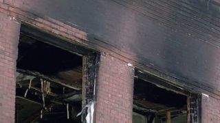 Demolition of top level of Galesburg building after fire
