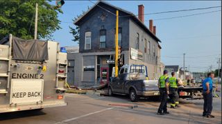 Tow truck crashes into Davenport building