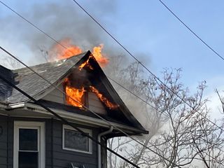 Firefighters battle Rock Island house fire with challenge of high winds