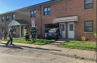 Car crashes through apartment building in Rock Island