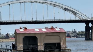  Davenport Fire Department boathouse floats down Mississippi River