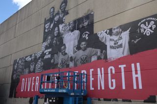 Student-made wheat paste mural highlighting community diversity returns to downtown Waterloo