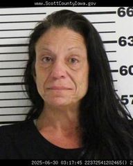 Woman accused of forcing her way into Davenport home and squeezing baby