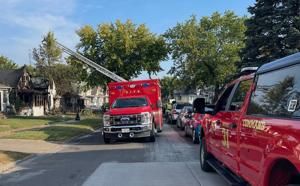 Early morning fire damages one Rock Island home, threatens another
