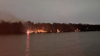  Crews use boat, hand tools to battle large brush fire along Rock River