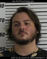 Davenport man arrested for accelerating vehicle into a police squad car