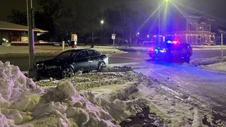  Car slides into pole due to icy roads, police say