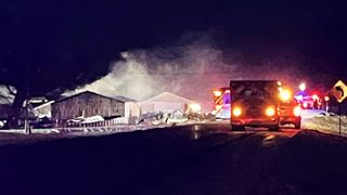 Dozens of firefighters battle QCA barn blaze