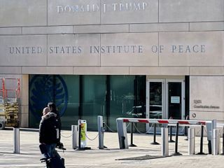 Trump is fighting the Institute of Peace in court. Now, his name is on the building