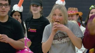 Moline teams chow down on donuts to benefit Share Joys campaign