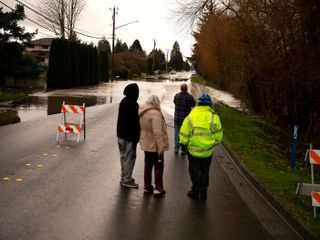 In photos: Flooding in Western Washington state forces thousands to evacuate