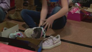 Hundreds of QCA students receive new shoes in nonprofit's first year of operation