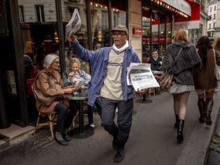 Ali Akbar, who's sold newspapers on the streets of Paris for 50 years, is now a knight