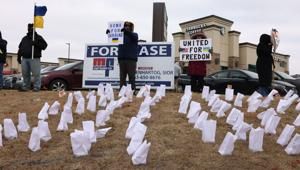 In freezing wind, Quad-Cities Ukrainians and their supporters rally as war enters 5th year