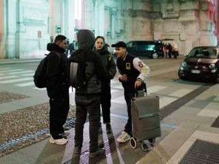 In the shadow of the Olympics, migrants search for a welcome in Milan