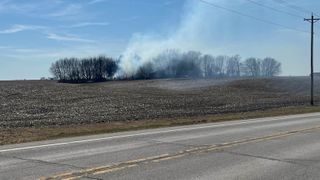 Crews fight multi-acre field fire