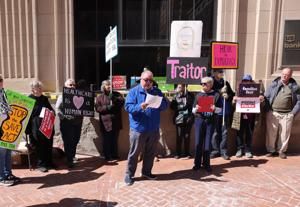 Demonstrators gather in Davenport for 16th anniversary of Affordable Care Act