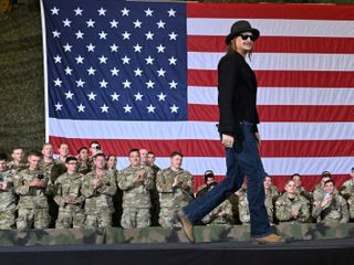 Army reviewing after helicopters hovered alongside Kid Rock's swimming pool as he saluted