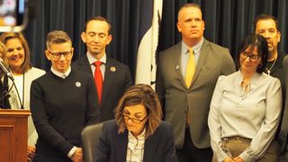  Gov. Kim Reynolds signs foster care training measure into law