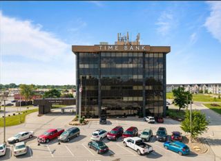 National real estate investment firm acquires historic QCA office towers