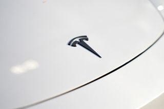 Tesla's profits beat expectations, but Elon Musk says big costs are ahead