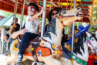 Decades-old, newly restored Smithsonian carousel reopens -- to children's delight