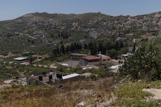 Israeli settlers force Palestinian family to exhume and rebury their father