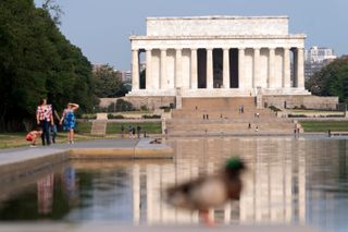 Nonprofit sues the federal government over plans to paint Lincoln Memorial Reflecting Pool blue