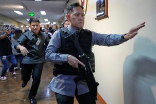 A Philippine senator wanted by the International Criminal Court flees from Senate