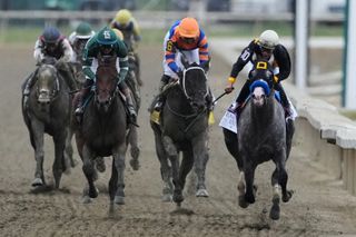 Napoleon Solo holds off Iron Honor to win the Preakness