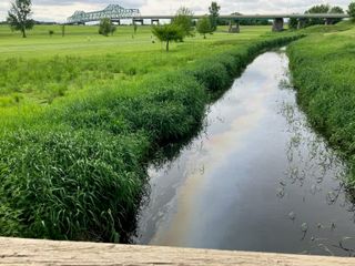 Emergency responders in Fulton for possible oil spill in Mississippi River creek