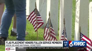  Volunteers place flags at Rock Island National Cemetery ahead of Memorial Day