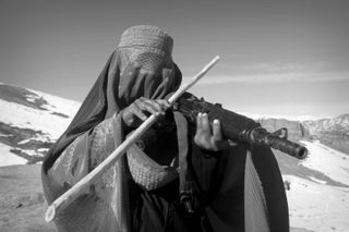 Mind-bending photos by anonymous cousins show the pain and dreams of Afghan women