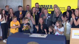 Gov. Kim Reynolds signs Iowa bill for pediatric cancer research