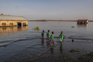 The biggest permanent desert lake threatens with rising waters and hungry crocs