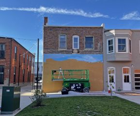 Windborn Group, QC Arts announce artist for mural in downtown Aledo