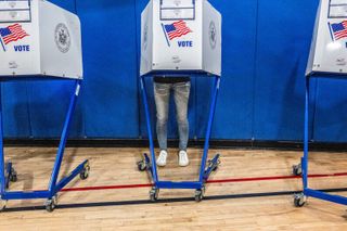 Trump keeps sabotaging legislation over a voting bill. Here's what's in it