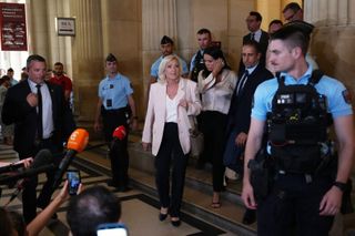 Le Pen says she'll run for French presidency next year despite court-ordered monitor