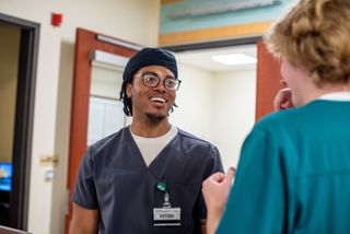 These men went to college in search of stable careers. They found it in nursing