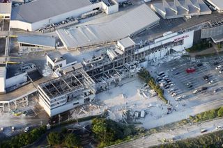 A 7.1 quake hits Japan's Kyushu, trapping people in a collapsed shopping center