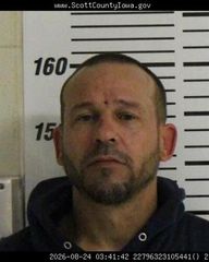 Davenport man arrested after allegedly striking person with axe
