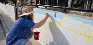 Burlington art teacher paints Leopold legacy mural in downtown area