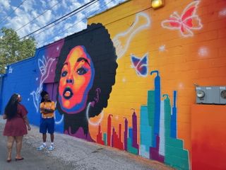 Zay Williams, Hilltop celebrate colorful new mural in Davenport