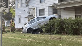 Crews on scene after car crashes into Moline home