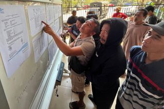 Indonesia searches for 129 people missing after ferry capsizes