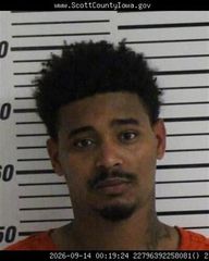 Moline man accused of possessing stolen gun out of Muscatine County