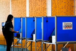 It's illegal for armed federal officers to be at polls. Lawsuits seek to ensure that