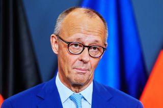 Germany's Merz vows to press ahead with reforms after historic state election defeat