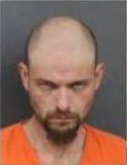 Man charged after allegedly hitting two men with vehicle, killing one in Milan