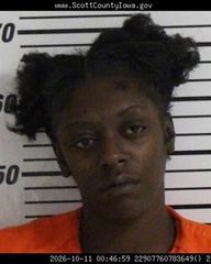 Davenport woman arrested after allegedly running over two with vehicle
